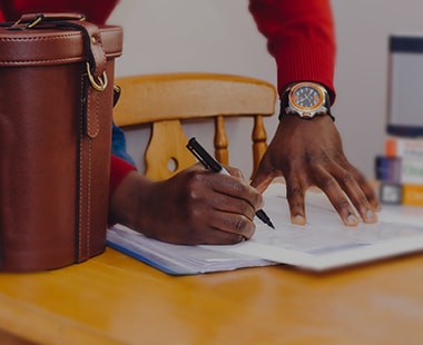 Picture of a man writing an application